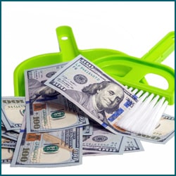 Dust pan with money in it