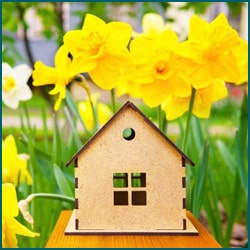 wooden home in front of flowers